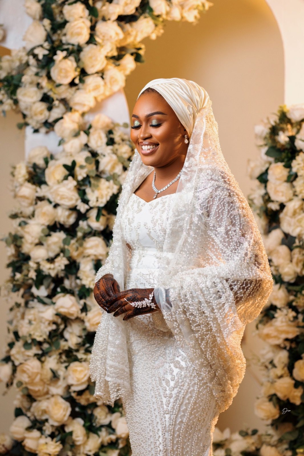 Bride styled by Haske Spa and Events in a pearl-beaded veil and gown