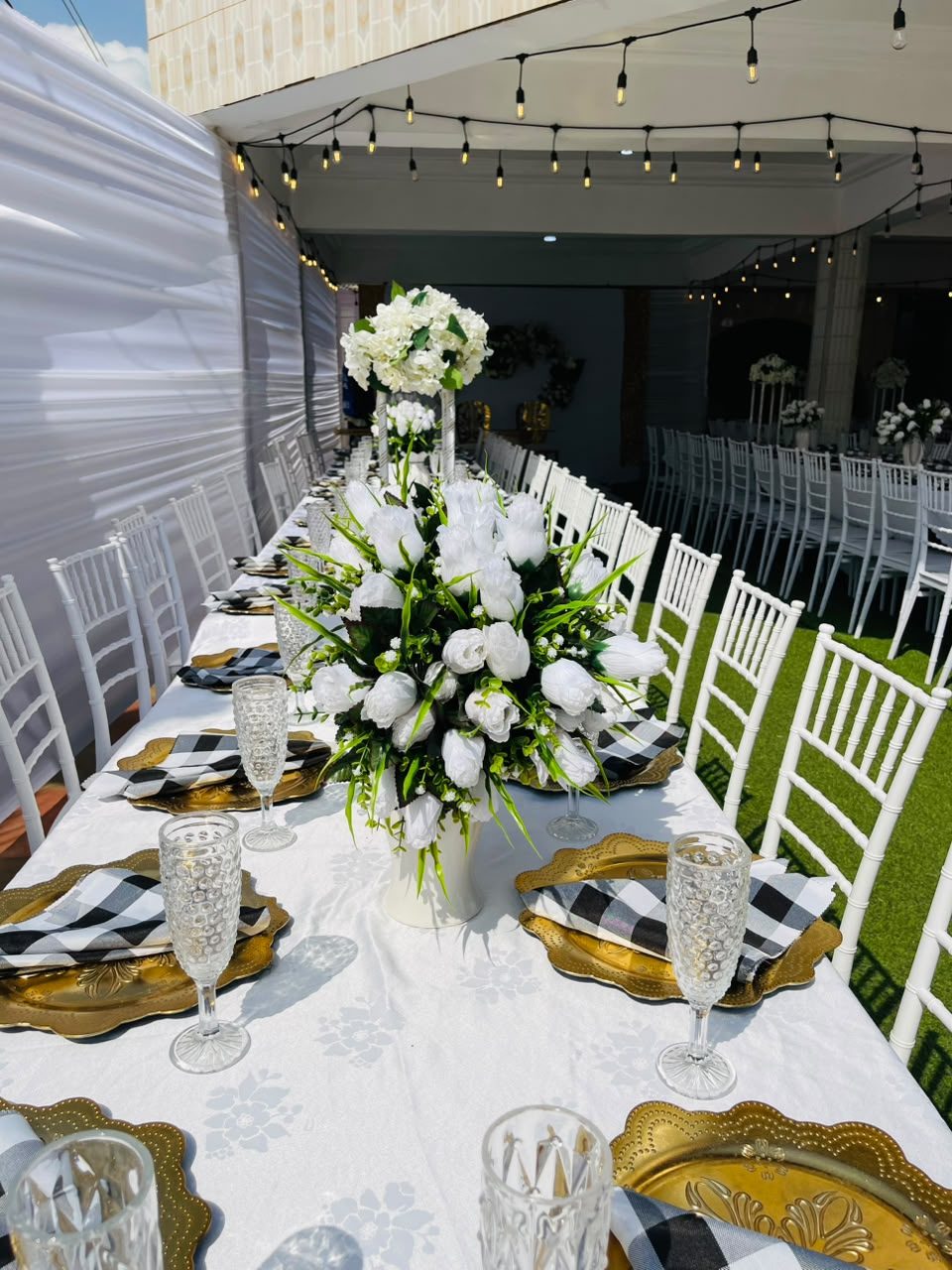 Gold and white reception table setup by Haske Spa and Events